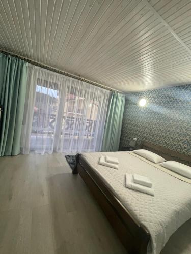 Postel nebo postele na pokoji v ubytování Рутенія