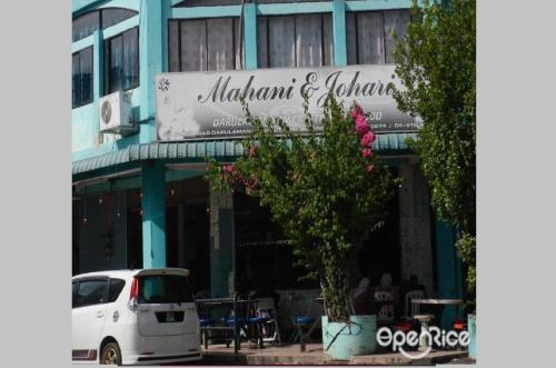 a white van parked in front of a building at Mahsuri Homestay in Jitra