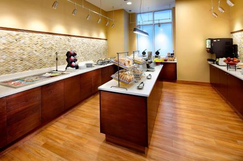 a kitchen with a counter with food on it at Residence Inn by Marriott Secaucus Meadowlands in Secaucus