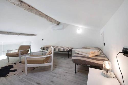 Postel nebo postele na pokoji v ubytování Le Coccinelle Home a Lierna