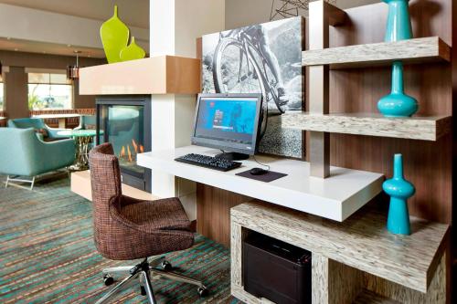 an office with a desk with a computer and a chair at Residence Inn by Marriott San Diego Chula Vista in Chula Vista