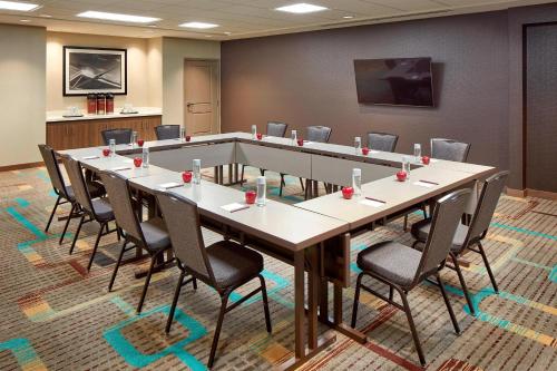 a conference room with a long table and chairs at Residence Inn by Marriott San Diego Chula Vista in Chula Vista