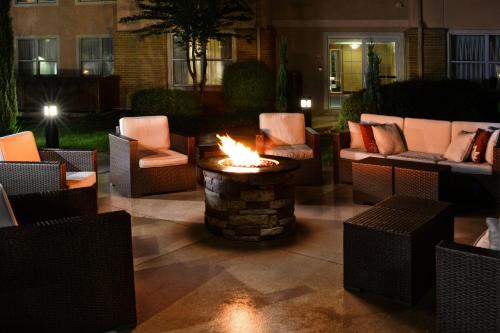a fire pit in the middle of a patio at Residence Inn by Marriott San Antonio Airport/Alamo Heights in San Antonio