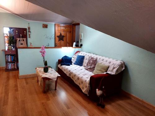 a bedroom with a bed and a table in a room at mansarda roulette in Saint Vincent