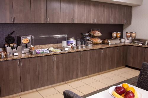 a kitchen with a counter with food on it at Residence Inn Eugene Springfield in Eugene