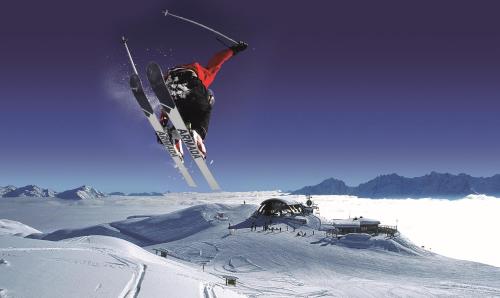 a person jumping in the air on skis at Landhaus Strickenmacher in Sillian