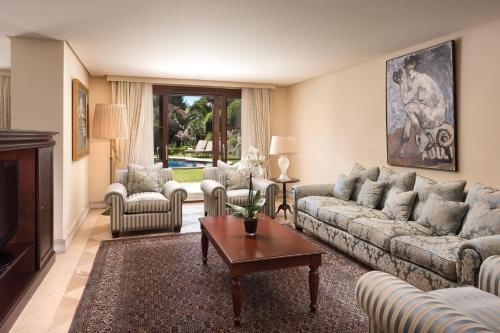 a living room with a couch and a table at Castillo Hotel Son Vida, a Luxury Collection Hotel, Mallorca in Palma de Mallorca