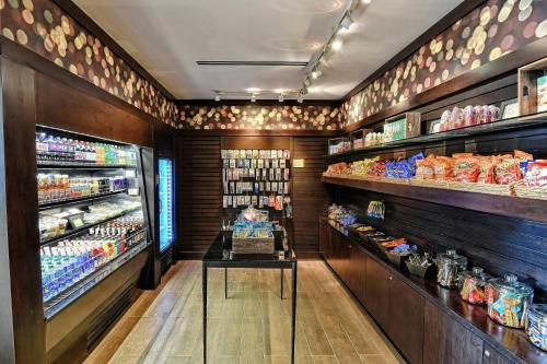 a grocery store aisle with shelves of food at Houston Marriott Sugar Land in Sugar Land