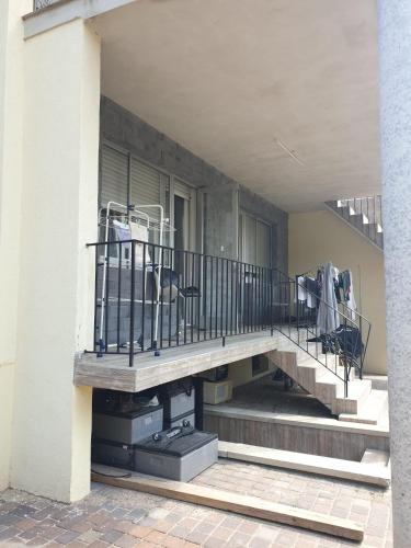 a porch with a staircase on a building at family in Schiltigheim