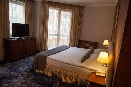 Postel nebo postele na pokoji v ubytování Meg-Lozenetz Hotel