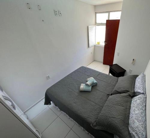Postel nebo postele na pokoji v ubytování Duplex Praia do frances pe na areia