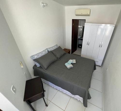 Postel nebo postele na pokoji v ubytování Duplex Praia do frances pe na areia