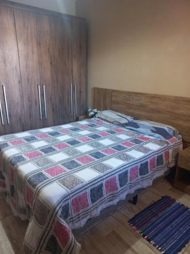 Giường trong phòng chung tại Casa charmosa Águas de Lindóia 2 km do centro