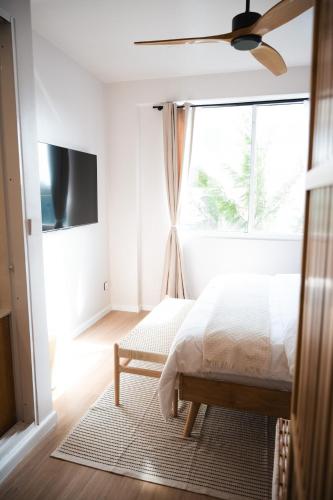 a bedroom with a bed and a window at Seasera Home 3BR Beachfront in Hulhumale