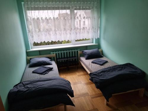 Una cama o camas en una habitación de Azimut