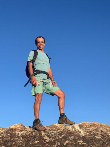 a man standing on top of a rock at Casa Matutina Colonial-Conforto Moderno no Centro Histórico in Pirenópolis