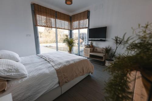 Ένα ή περισσότερα κρεβάτια σε δωμάτιο στο Villa luxe Ibiza Style, with heated pool