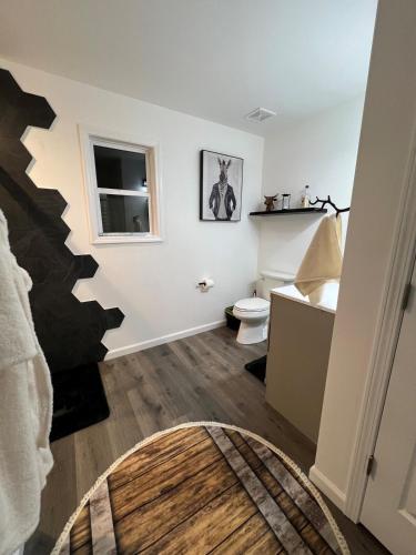 a bathroom with a staircase and a toilet at Downtown Bourbon House in Somerset