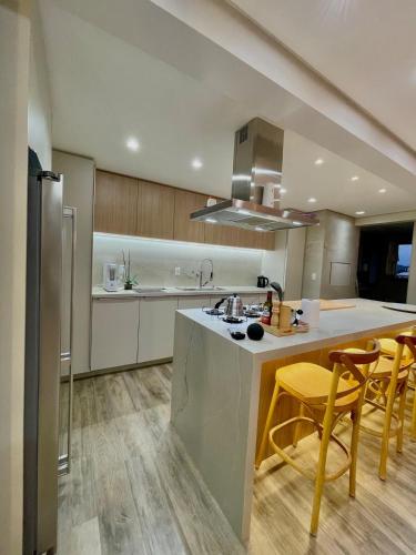 a kitchen with a sink and a counter top at Cobertura Amanhecer em Dois Irmãos in Dois Irmãos