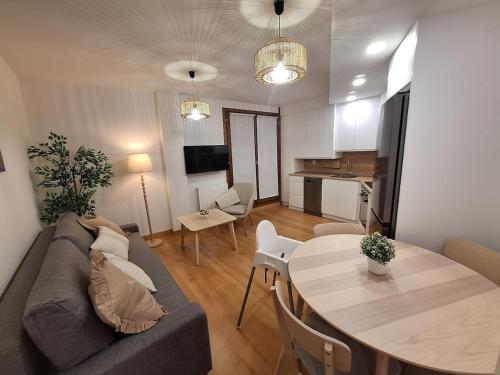 a living room with a couch and a table at EscarraSuite in Escarrilla