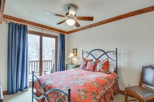 a bedroom with a bed and a ceiling fan at Cozy Avon Retreat w/ Private Deck & Pool Access! in Avon