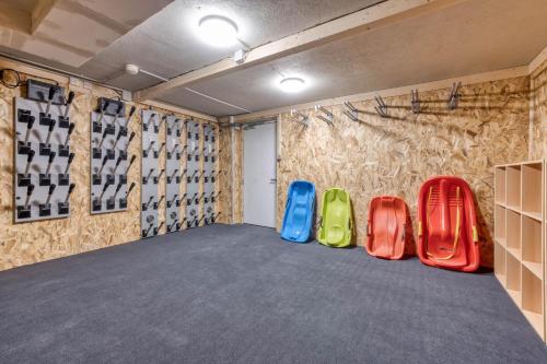 a row of colorful chairs in a room at Hôtel Lyret in Chamonix-Mont-Blanc