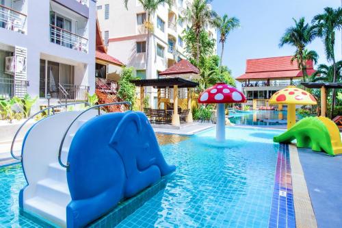 a pool at a resort with a water slide at Hua Hin First-Hin Nam in Hua Hin