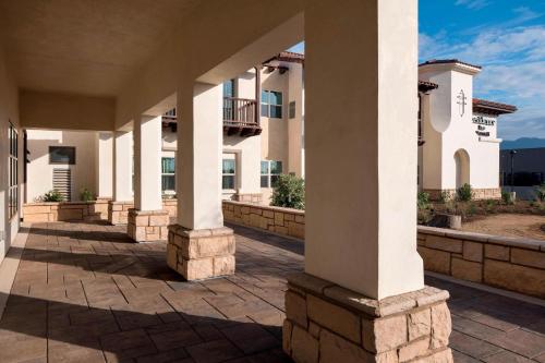 a row of columns in a courtyard of a building at Residence Inn by Marriott Santa Barbara Goleta in Santa Barbara