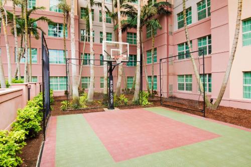 a basketball hoop in front of a pink building at Residence Inn Fort Lauderdale SW/Miramar in Miramar