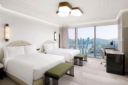 a hotel room with two beds and a window at Josun Palace, a Luxury Collection Hotel, Seoul Gangnam in Seoul