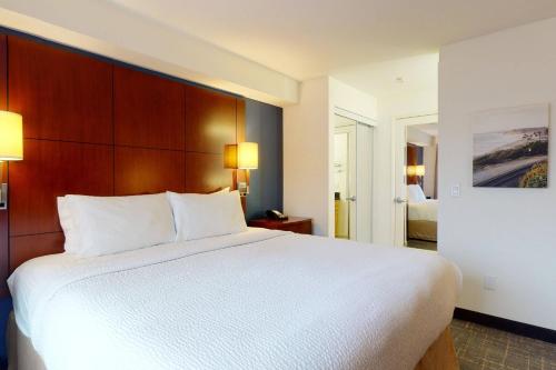 a large white bed in a hotel room at Residence Inn San Diego Del Mar in San Diego
