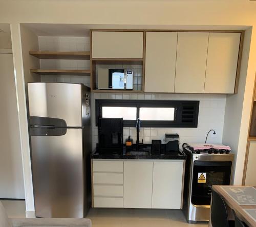 Dapur atau dapur kecil di Apto com varanda e ótima localização