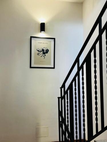 a picture on a wall with a picture on the wall at Sicilia Vacation rooms in Trapani