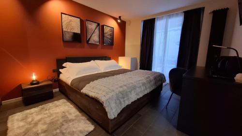 a bedroom with a large bed and a window at Hotel La Thuile Resort & SPA in La Thuile