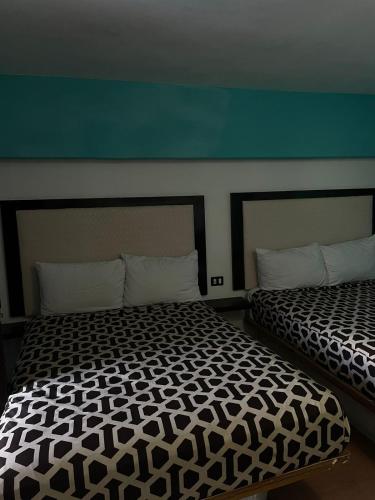 Кровать или кровати в номере Hotel Essen's