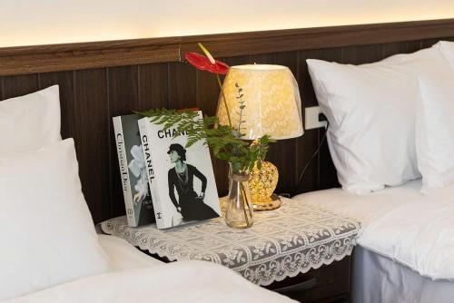 Postel nebo postele na pokoji v ubytování Olagi Hotel 2