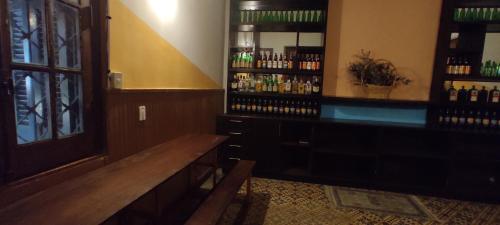 a room with a bar with bottles of wine at Mediterraneo Youth Hostel in Asuncion