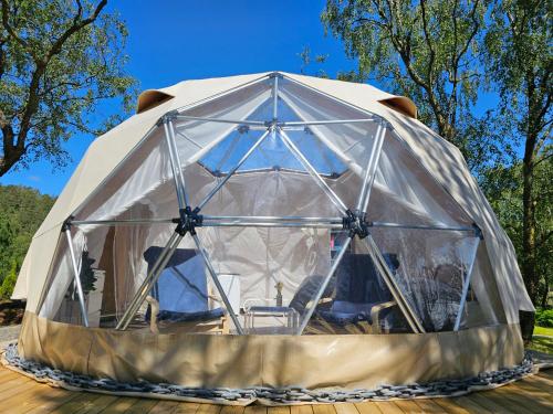 a large tent with a chair inside of it at NorGlamp Glamping in Hjelmeland