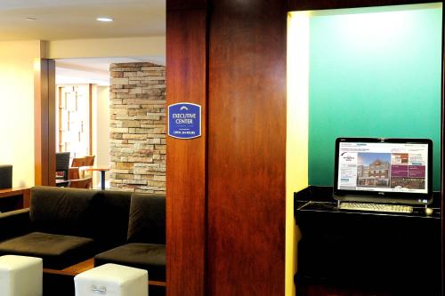 a room with a laptop computer on a door at Residence Inn Long Island Holtsville in Holtsville