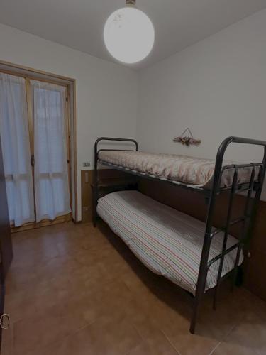 Letto o letti in una camera di Casa Giusy