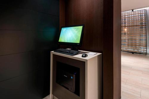 a desktop computer sitting on top of a fireplace at Residence Inn by Marriott Jersey City in Jersey City