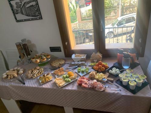 a table with many different types of food on it at B&B Didova in Gavoi