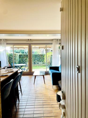 a living room with a couch and a table at Le Mouette - Seaside in La Rochelle