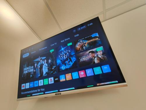 a flat screen tv with movies on it at TREASURE BOX At Heritage Georgetown in George Town