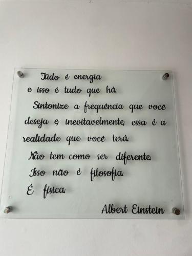 a white board with writing on a wall at Casa Estelar in Cabo Frio