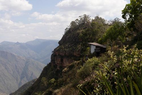 a small building on the side of a mountain at REFUGIO LA ROCA in Los Santos