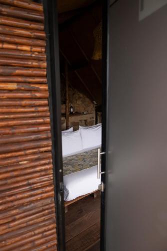 a door open to a room with two beds at REFUGIO LA ROCA in Los Santos