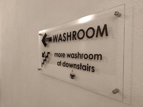 a sign on a wall that says washington and move wisdom ofdowntidents at TREASURE BOX At Heritage Georgetown in George Town