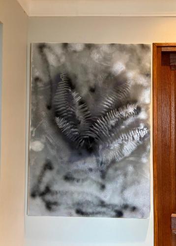 a black and white picture on a wall at Cozy apartment with a relaxing terrace, 10 min from beaches and restaurants in Marigot