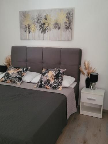 Postel nebo postele na pokoji v ubytování Apartments Lanterna Ražanac